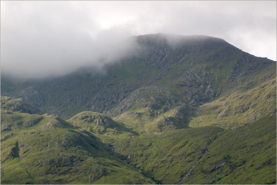 The lethal North face of Luinne Bheinn's summit in morning mist, as seen from way down on the Barisdale plain