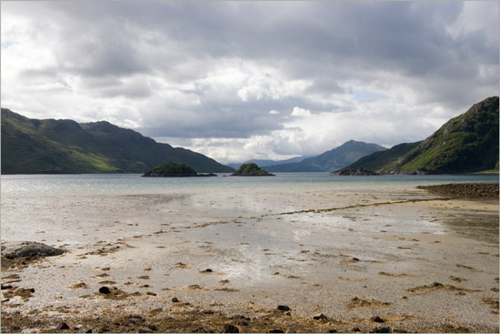 Barisdale Bay in late afternoon light; rough water and a liquid beach