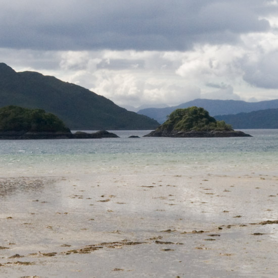 Zoom: Barisdale Bay in late afternoon light; rough water and a liquid beach