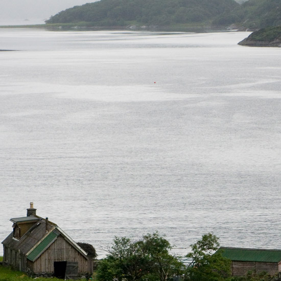 Zoom: Skiary and Loch Hourn in gloomy weather; romantic refuge in an abandoned landscape