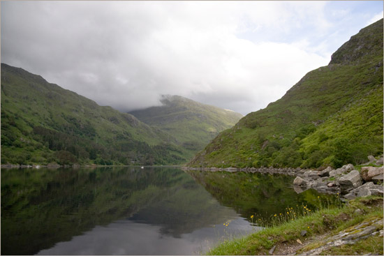 Tranquil Loch Beag and Kinloch Hourn at high tide in the evening, from the path near the rock fall