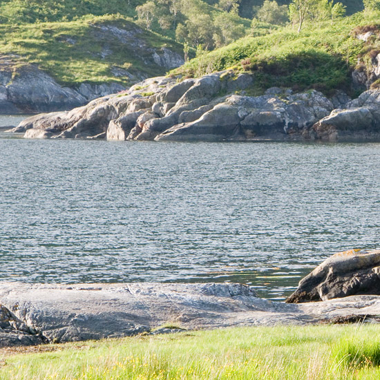 Eilean Mhogh-sgeir in the early evening sun, as seen from Runeval