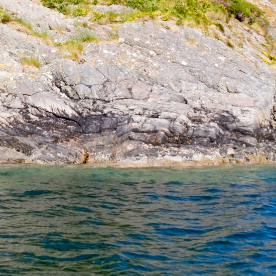 Zoom: Late afternoon sun on one of the Corr Eileanan guarding the entrance to inner Loch Hourn